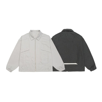 Unisex short jacket in boxy cut with continuous zipper and flap pockets EVA-US