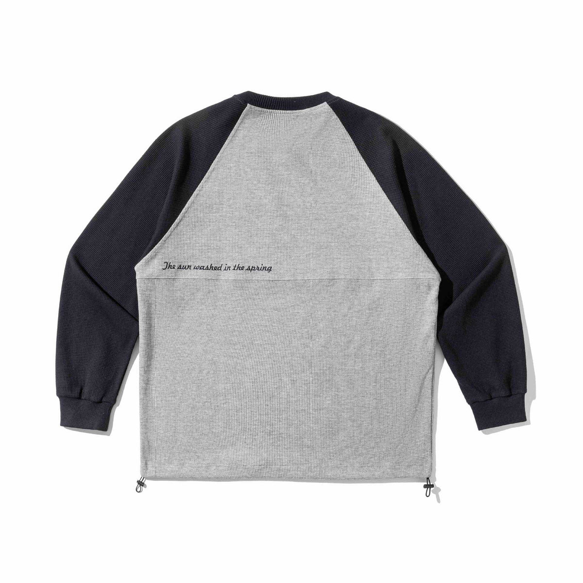 Unisex Raglan Sweatshirt with thermal waffle texture, drawstring hem, and discreet chest embroidery EVA-US