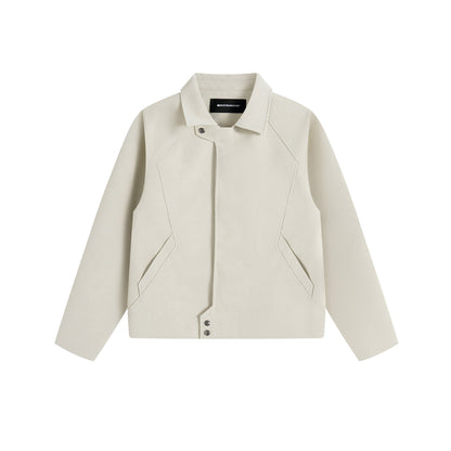 Men's short jacket in suede look with asymmetric front flap and geometric flap pockets.