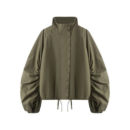 Women's transitional jacket with wide balloon sleeves, stand-up collar and drawstring.