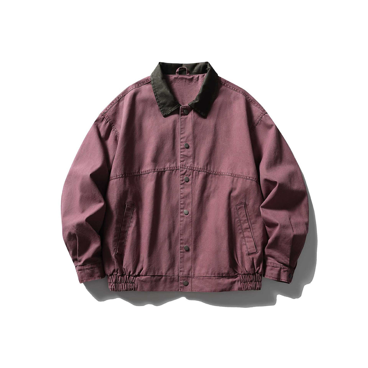Men's tailored canvas blouson with contrasting leather collar and elastic hem.