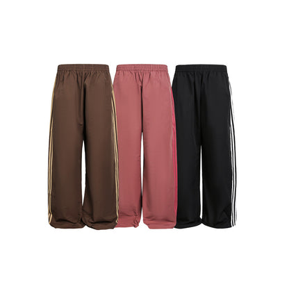 Women's wide satin training pants with elastic waistband and side contrast stripes EVA-US