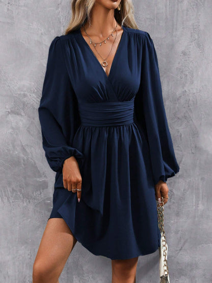 Women's wrap dress with a stylish V-neck and voluminous sleeves
