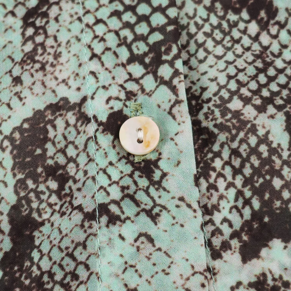 Women's blouse with waterfall shawl collar and snake print EVA-US