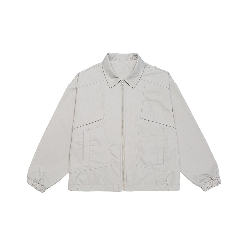 Unisex short jacket in boxy cut with continuous zipper and flap pockets EVA-US