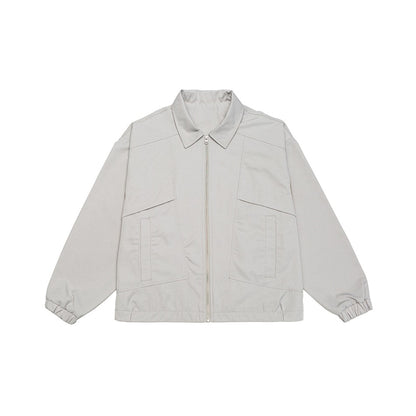 Unisex short jacket in boxy cut with continuous zipper and flap pockets EVA-US
