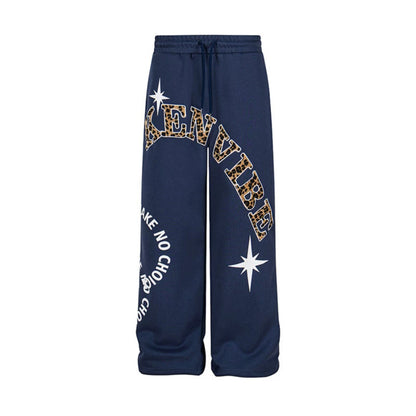 Women's wide jogging pants in culotte style with drawstring and statement print EVA-US