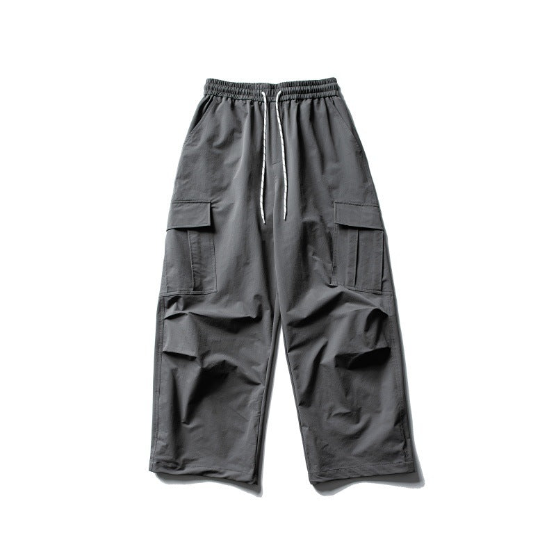 Unisex Wide Cargo Utility Pants in Baggy Cut with Elastic Drawstring and Generous Flap Pockets