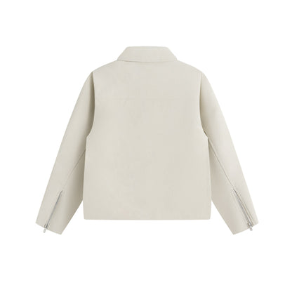 Men's short jacket in suede look with asymmetric front flap and geometric flap pockets.