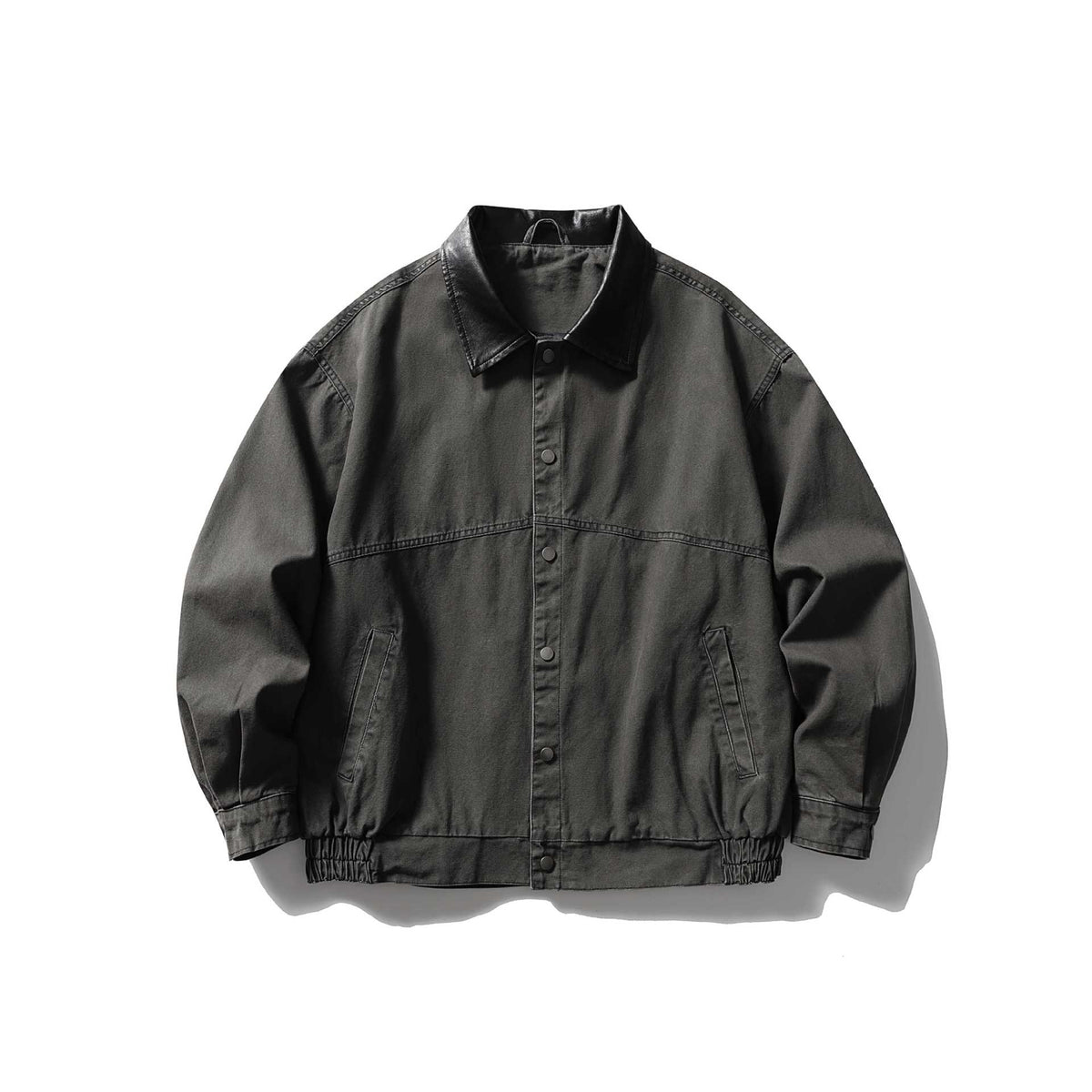 Men's tailored canvas blouson with contrasting leather collar and elastic hem.