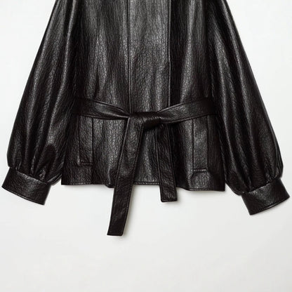 Women's short jacket made of faux leather with high buckle collar and waist belt EVA-US