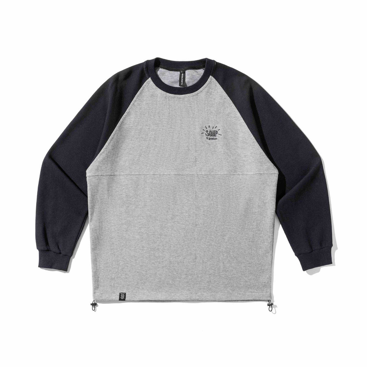 Unisex Raglan Sweatshirt with thermal waffle texture, drawstring hem, and discreet chest embroidery EVA-US