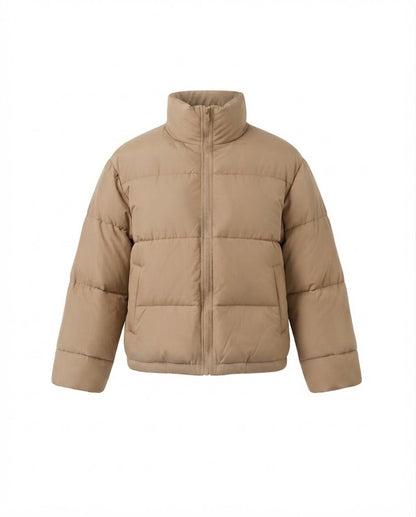Women's short boxy travel puffer jacket with high collar, reinforced thermal lining, and elastic cuffs