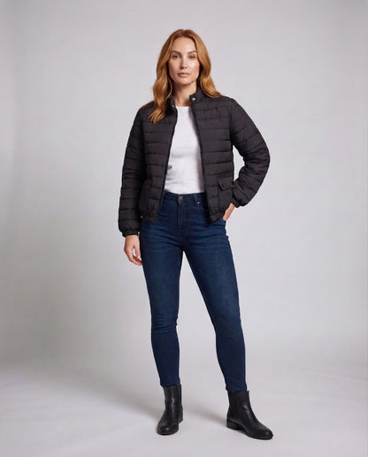 Women's lightweight short quilted thermo puffer jacket with flap pockets, elastic cuffs, and high stand-up collar