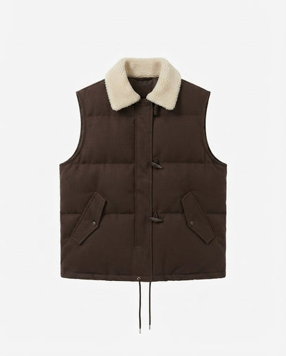 Women's short-cut suede look quilted vest with teddy collar, toggle closures, and drawstring hem