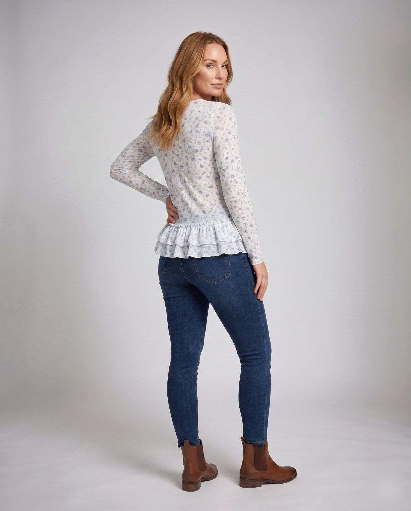 Ladies blouse with fresh floral print and playful ruffled hem - Chichicherry