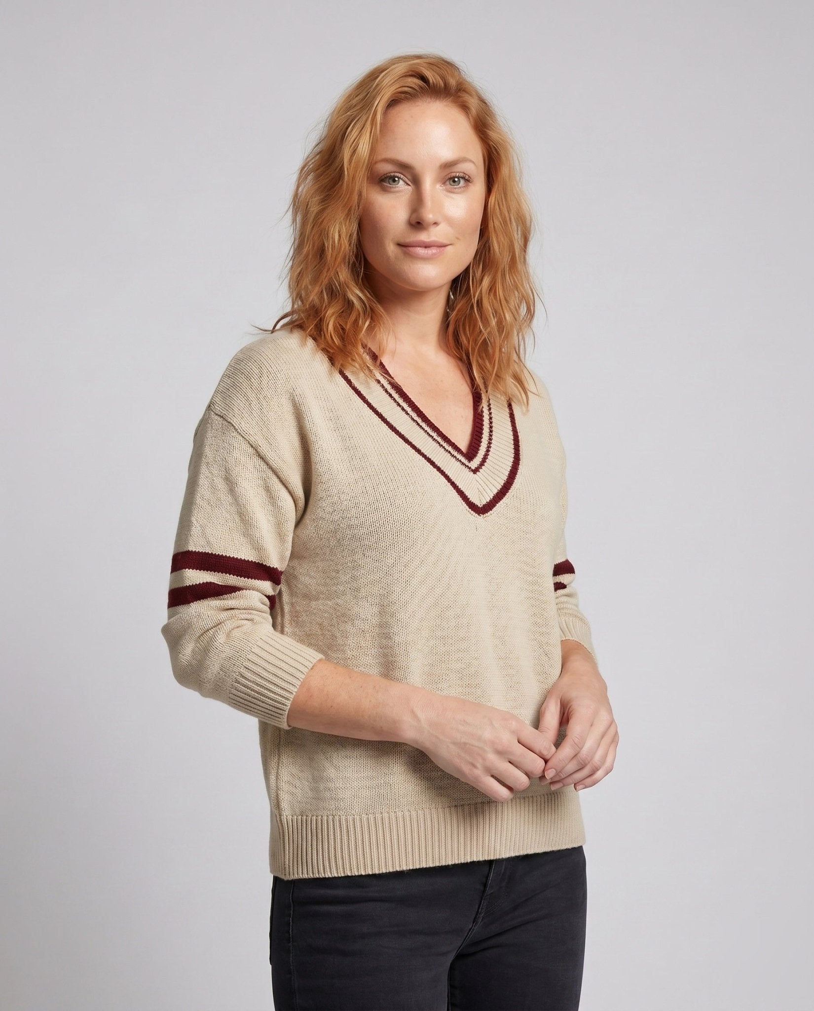 Women's knit sweater with deep V-neck and sporty stripes - Chichicherry