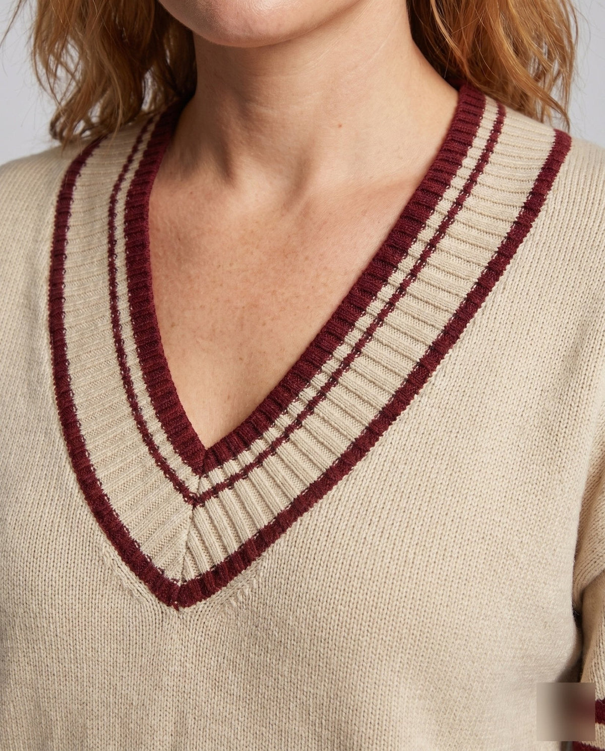 Women's knit sweater with deep V-neck and sporty stripes - Chichicherry