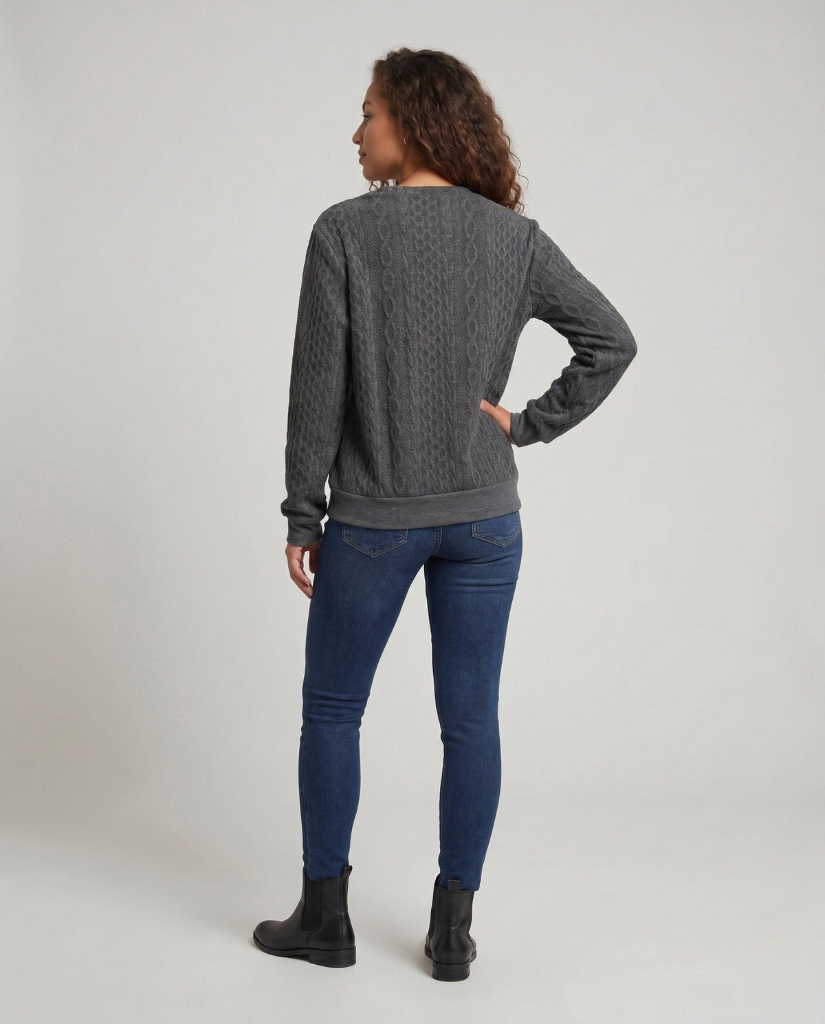 Women's knit sweater with diagonal button decoration and textured surface - Chichicherry