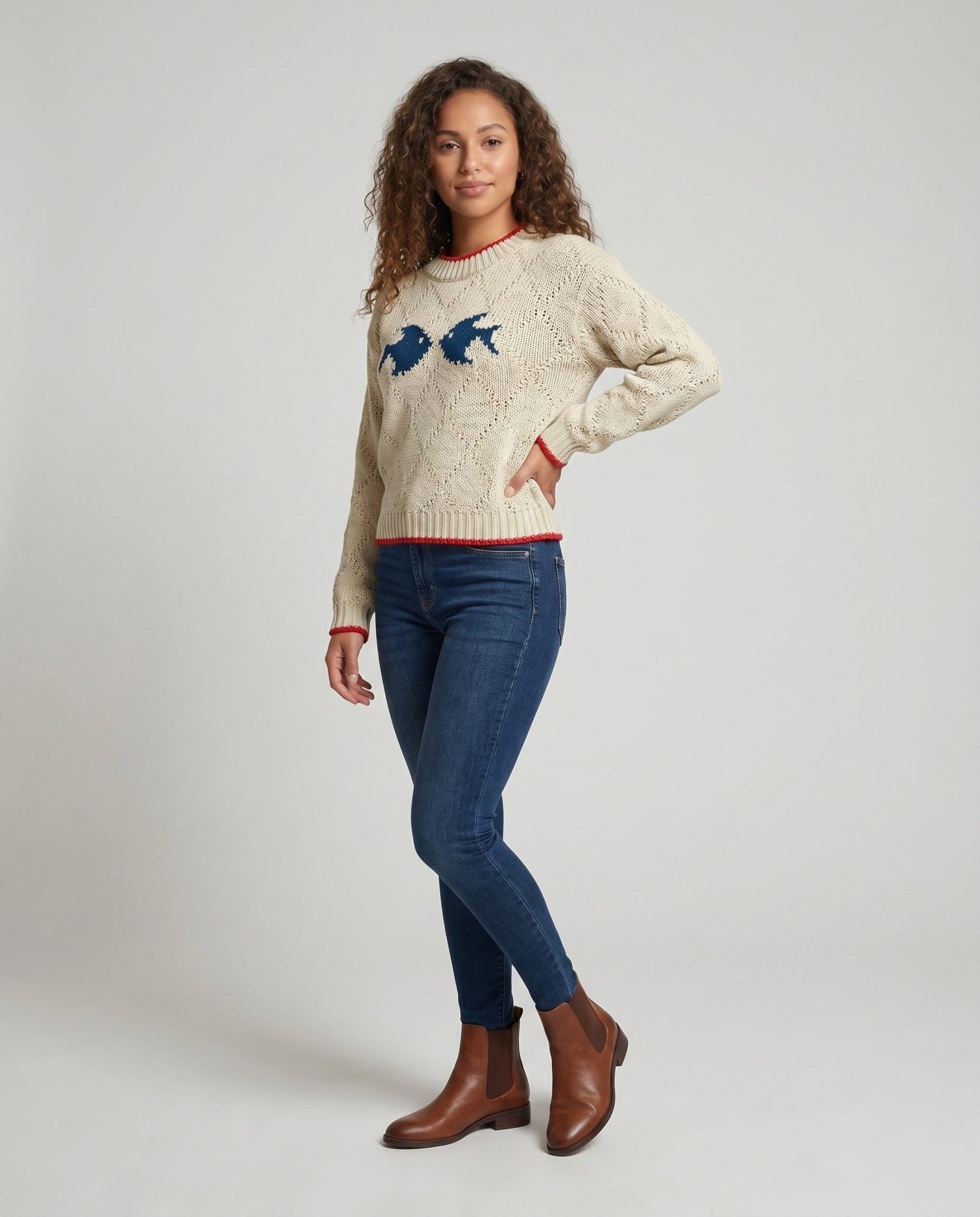 Women's knit sweater with fish motif and colorful hem - Chichicherry