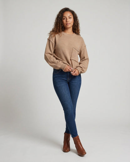 Women's knit sweater with unique structural details and a practical chest pocket - Chichicherry