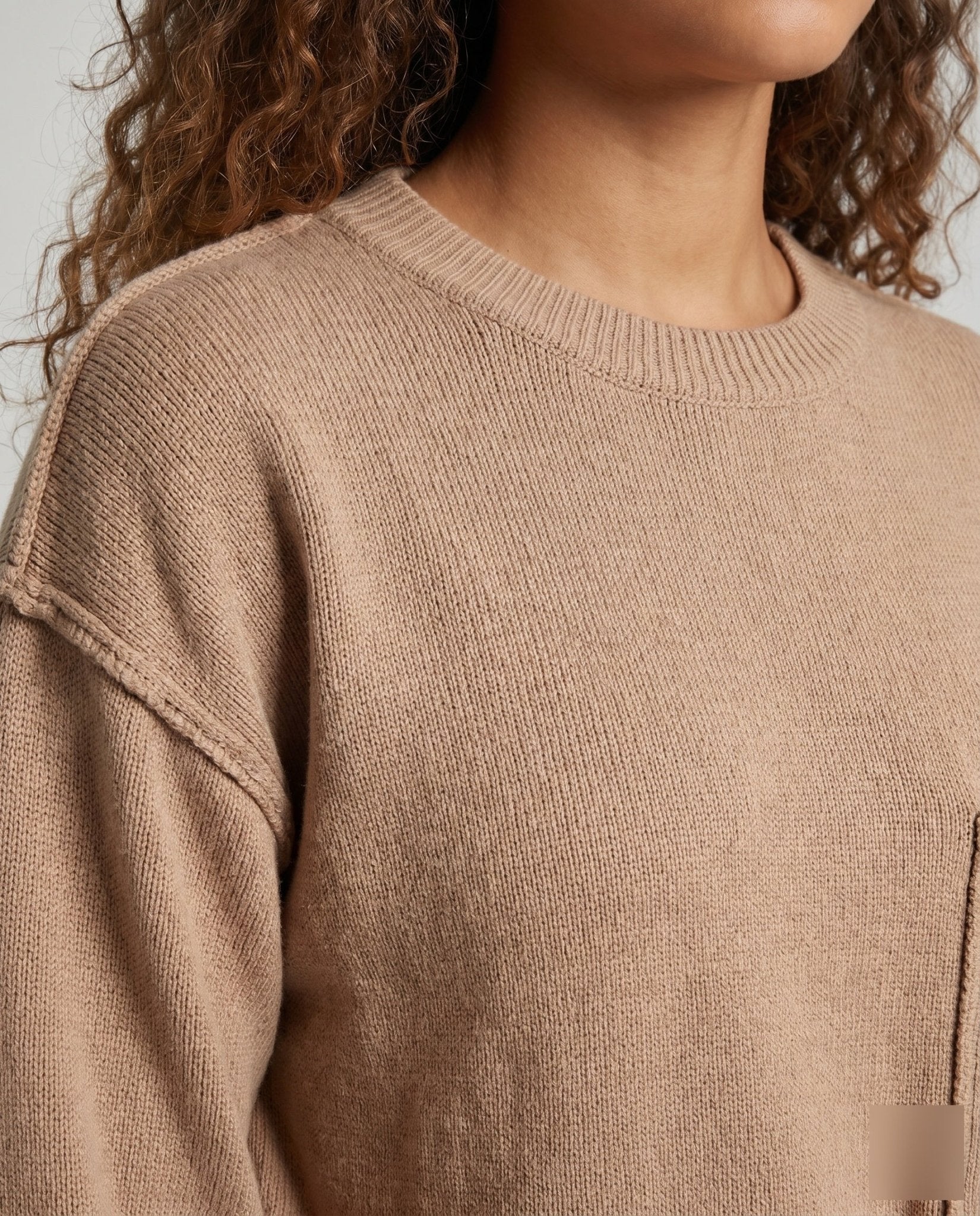 Women's knit sweater with unique structural details and a practical chest pocket - Chichicherry