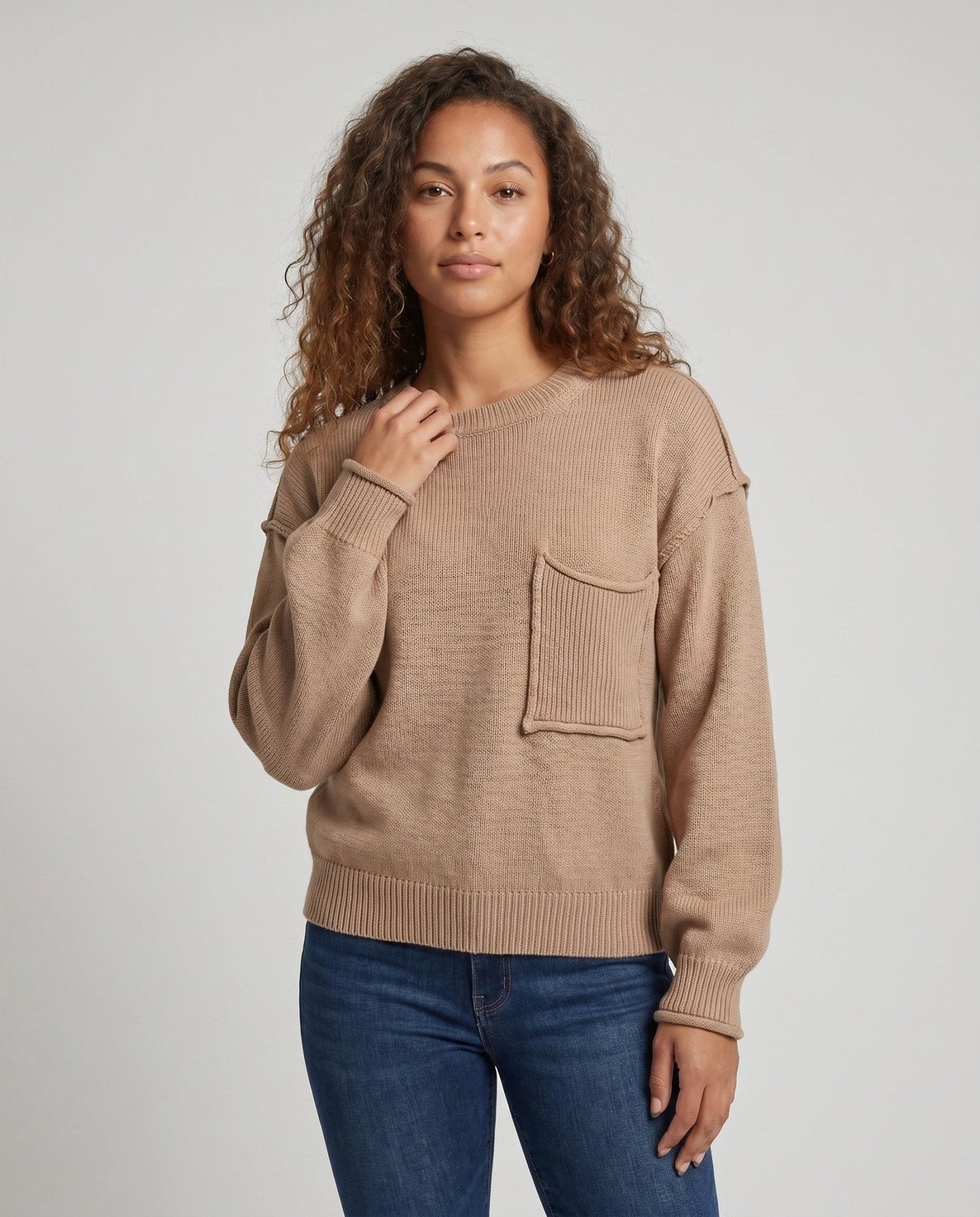 Women's knit sweater with unique structural details and a practical chest pocket - Chichicherry