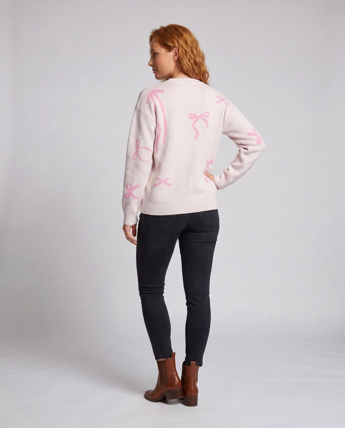 Women's knitted sweater with playful bow motifs - Chichicherry