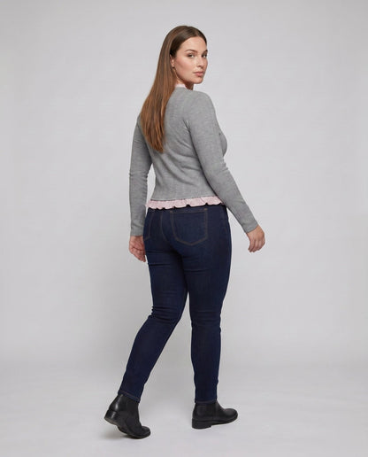 Women's long sleeve blouse with playful ruffled hem and decorative loop design - Chichicherry
