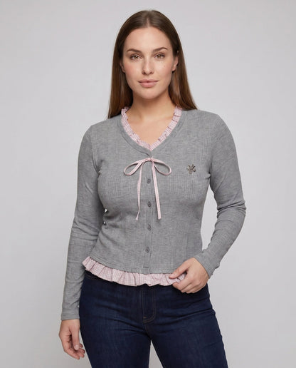 Women's long sleeve blouse with playful ruffled hem and decorative loop design - Chichicherry