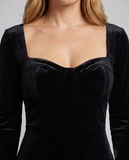 Women's mini dress with elegant pleated hem and tailored top - Chichicherry