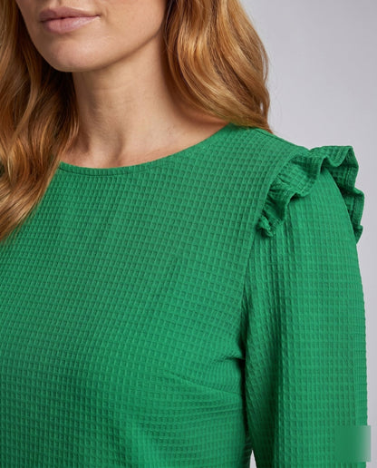 Women's top with ruffle details and textured fabric - Chichicherry